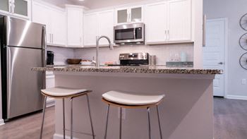 Modern kitchens with stand-alone islands and breakfast bars